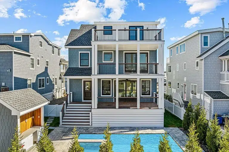 Exterior and interior gallery of the 40 Inlet Drive North project by Vallese Contractors, showcasing a blend of coastal style, spacious layouts, and refined finishes.